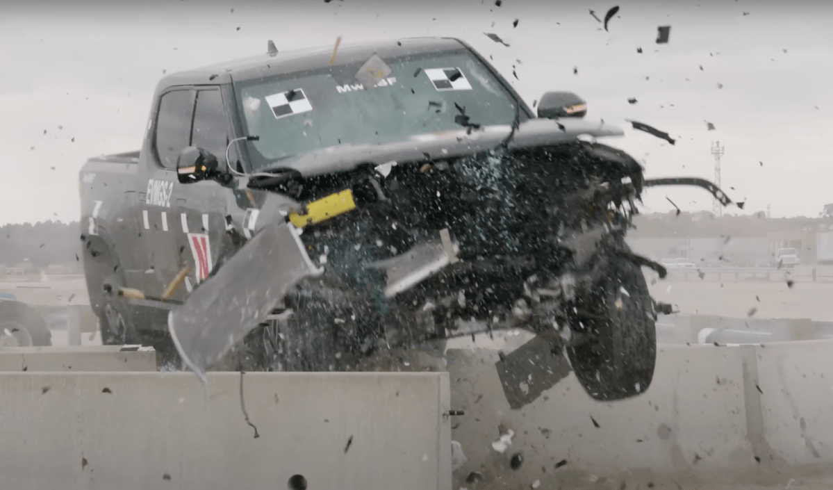 Watch 7,000-Pound Rivian Smash Through Guard Rail and Concrete Barrier