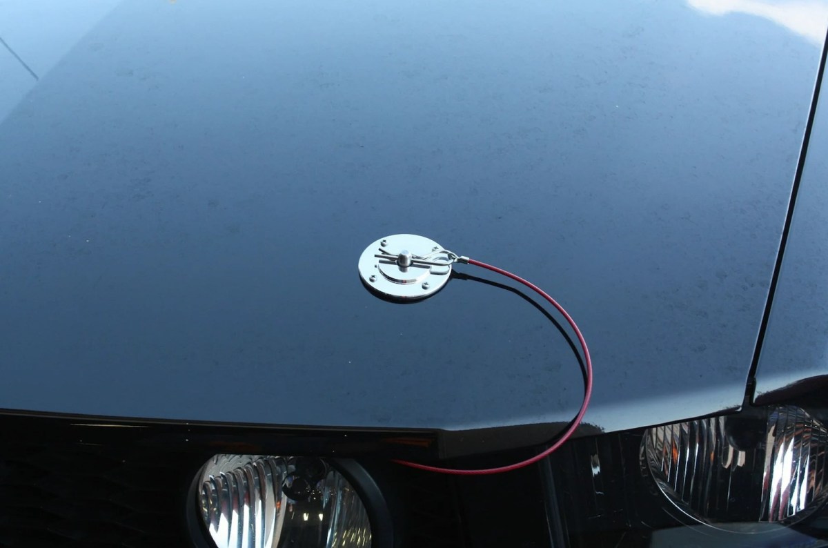 Why Do Some Sports Cars Have Pins Sticking out of Their Hoods?